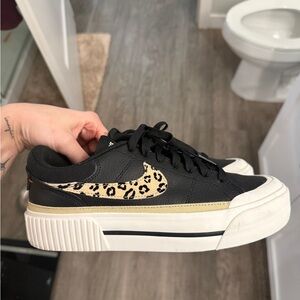 Nike Women's Black Sneakers with Leopard Swoosh and Gold Trim